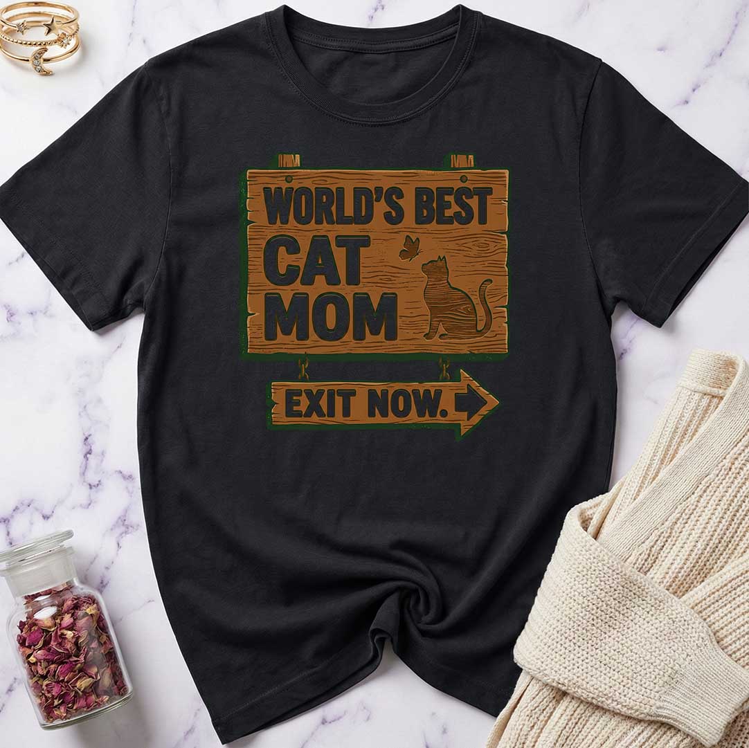 Black t-shirt with 'World's Best Cat Mom Exit Now' text on a marble surface.
