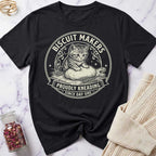 Black t-shirt with a cat graphic and 'Biscuit Makers Union' text on a marble surface.