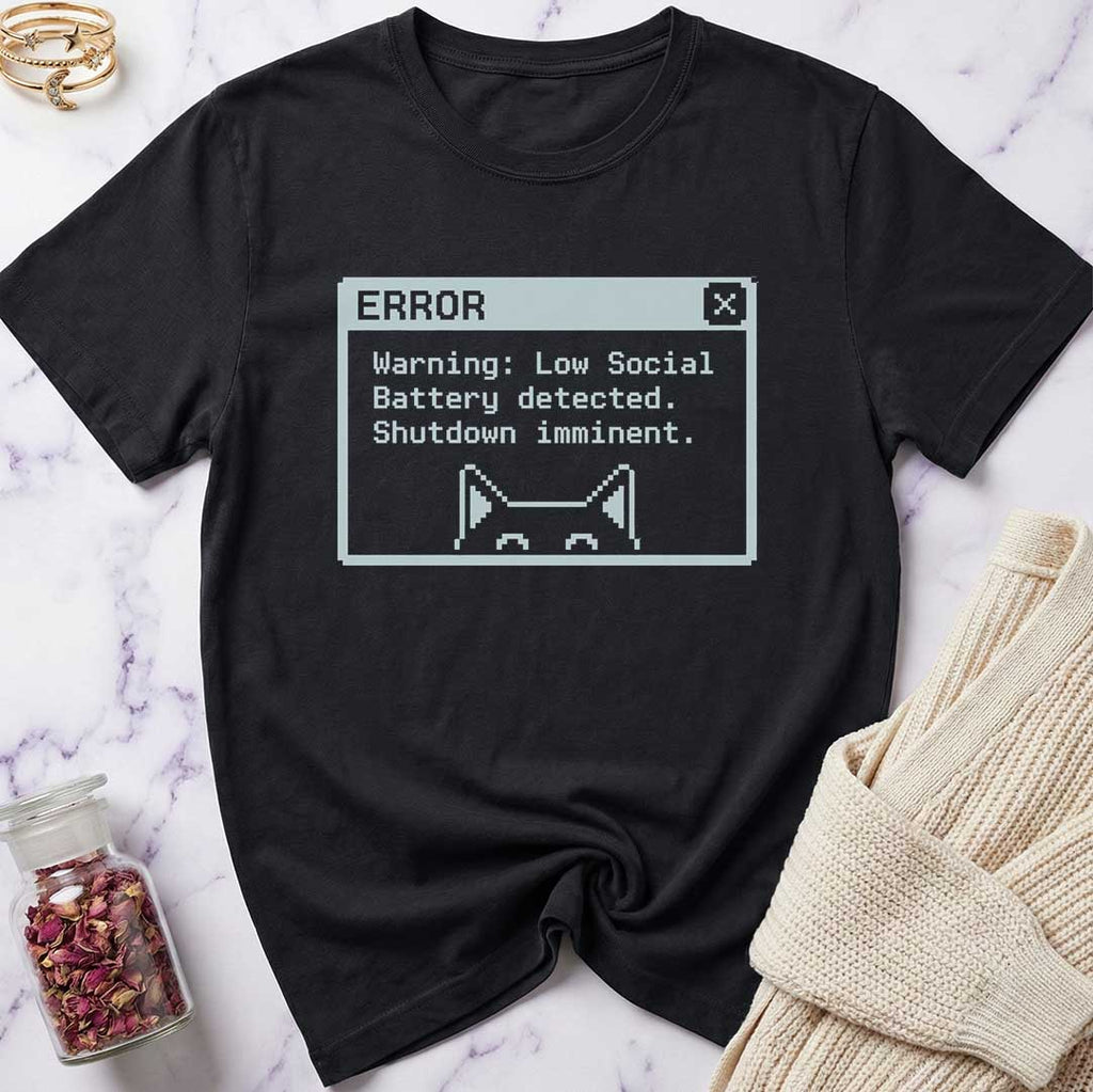 Black t-shirt with a digital error message design on a marble surface.
