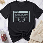 Black t-shirt with a digital error message design on a marble surface.