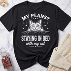 Black t-shirt with a cat graphic and text on a marble surface