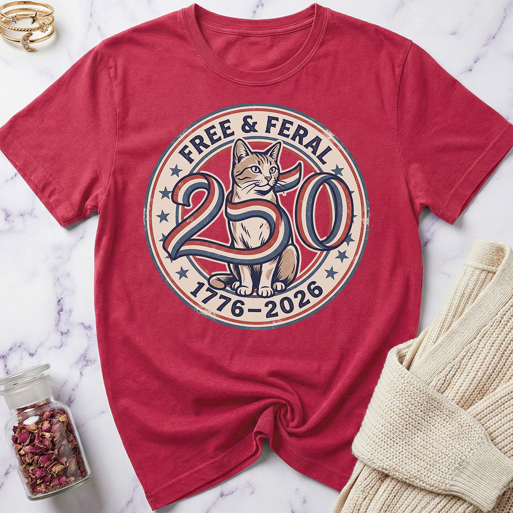 Red t-shirt with a cat graphic and text on a marble surface