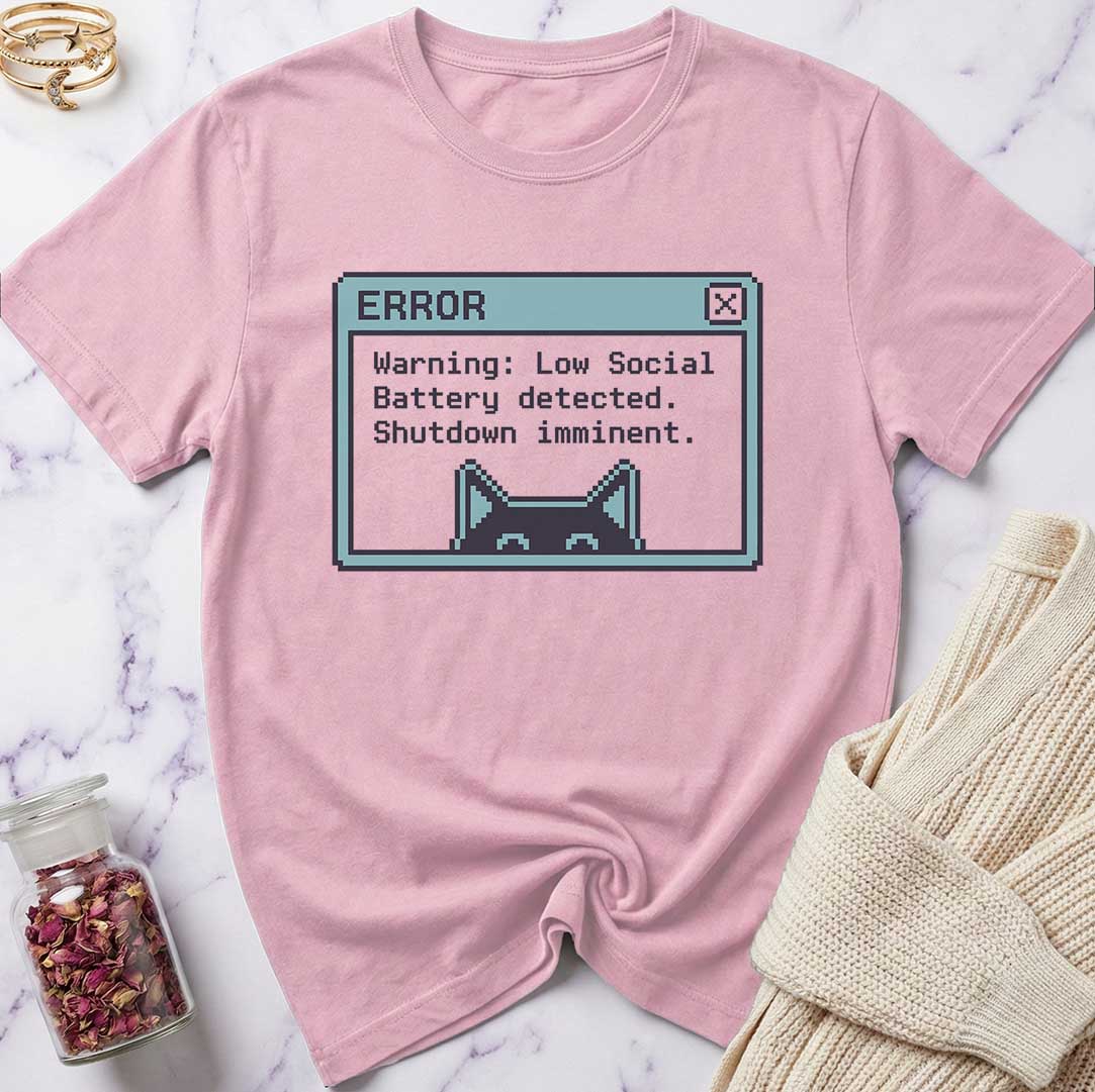 Pink t-shirt with a graphic design on a marble surface