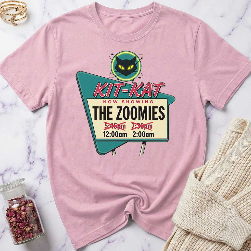 Pink t-shirt with a graphic design on a marble surface
