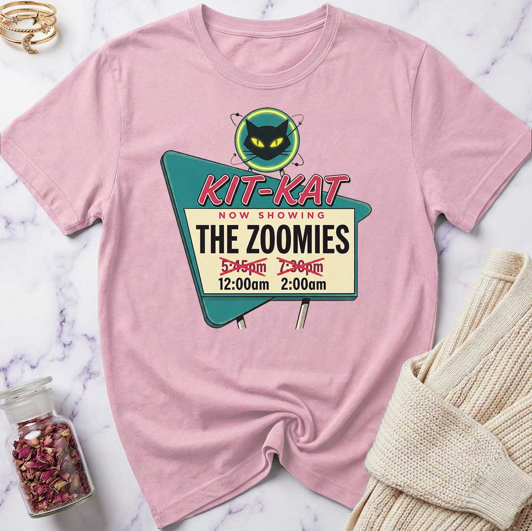 Pink t-shirt with a graphic design on a marble surface