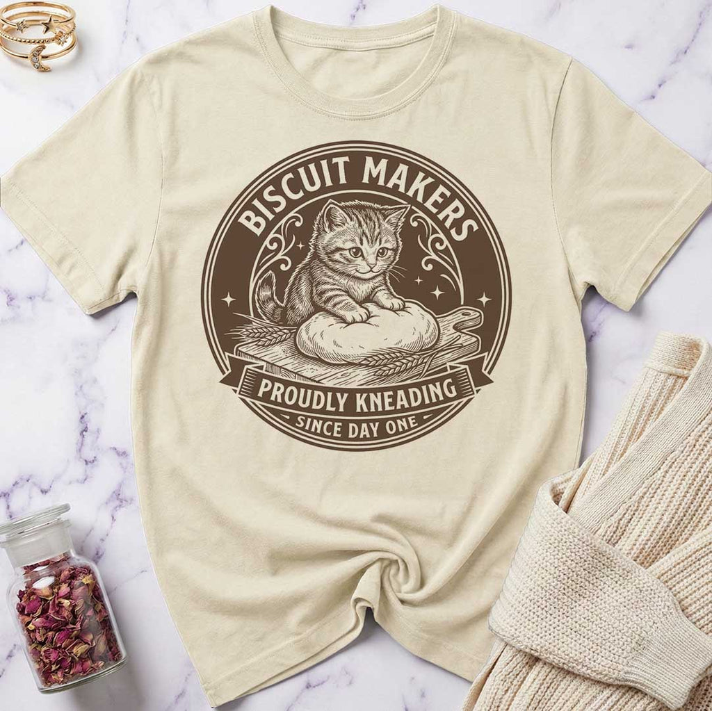 Natural t-shirt with a cat graphic and text on a marble surface