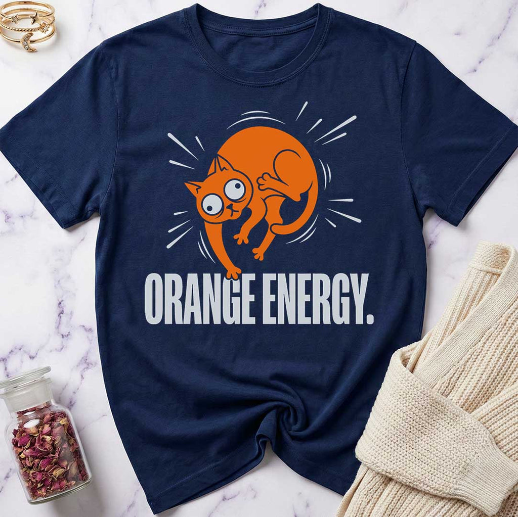 Navy blue t-shirt with orange cat graphic and 'Orange Energy' text on a marble surface.