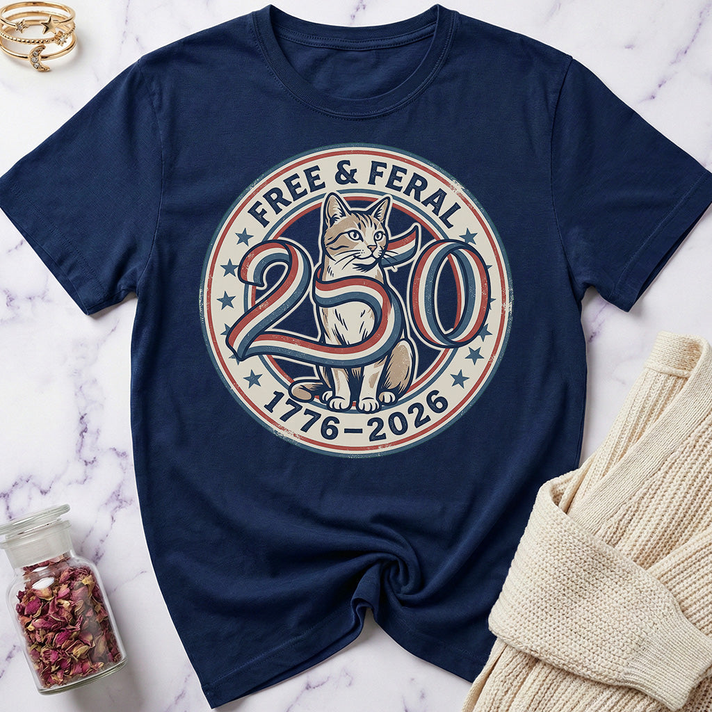 Navy blue t-shirt with a cat graphic and text on a marble surface