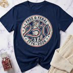Navy blue t-shirt with a cat graphic and text on a marble surface