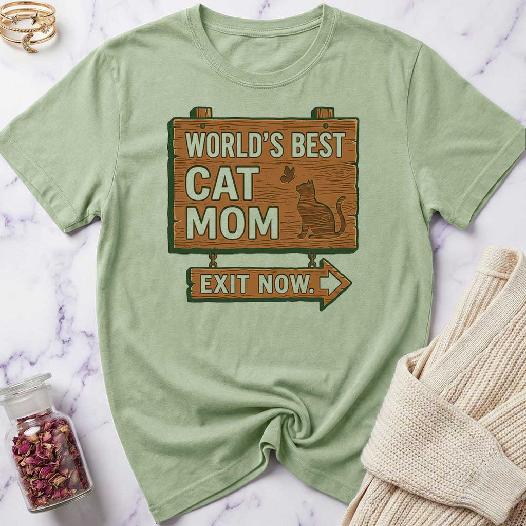 Light green t-shirt with 'World's Best Cat Mom Exit Now' graphic on a marble surface.