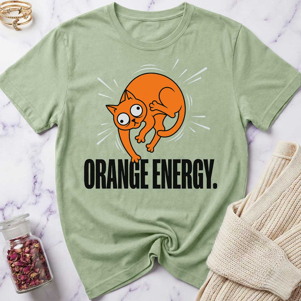 Green t-shirt with orange cat graphic and 'Orange Energy' text on a marble surface.