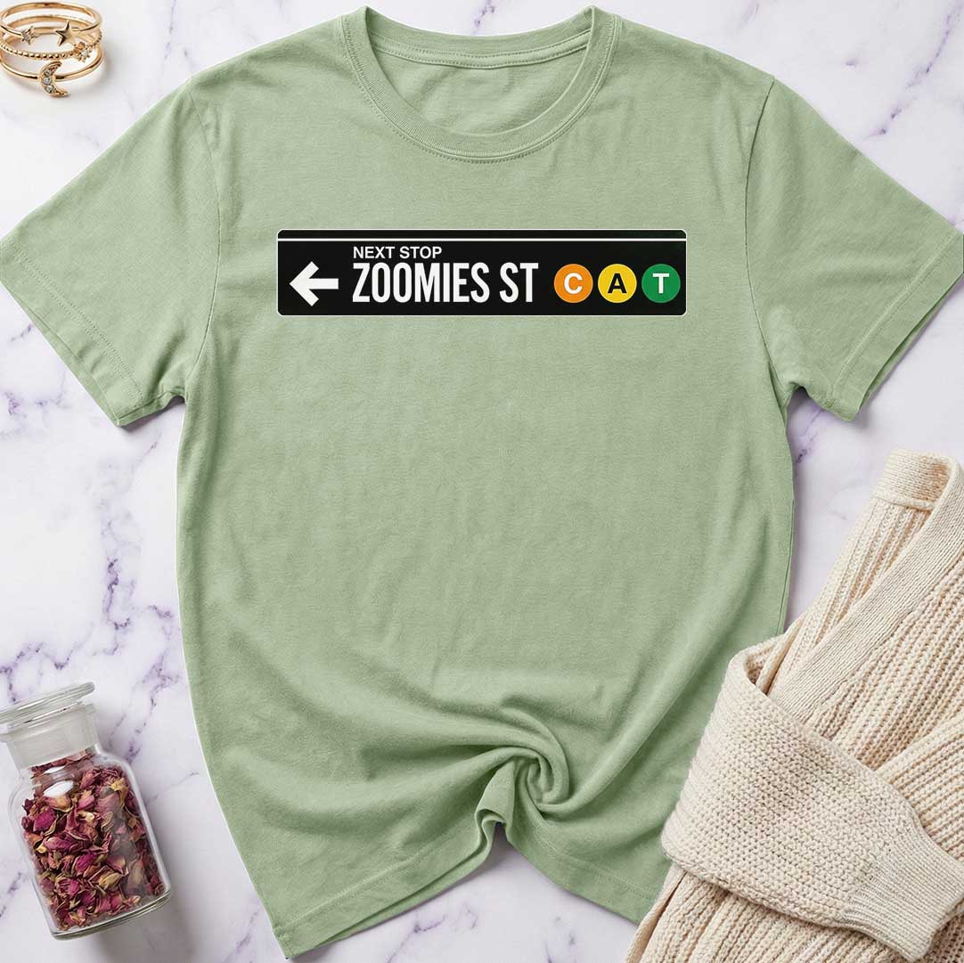 Green t-shirt with a graphic design on a marble surface
