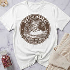 White t-shirt with a cat graphic and text on a marble surface