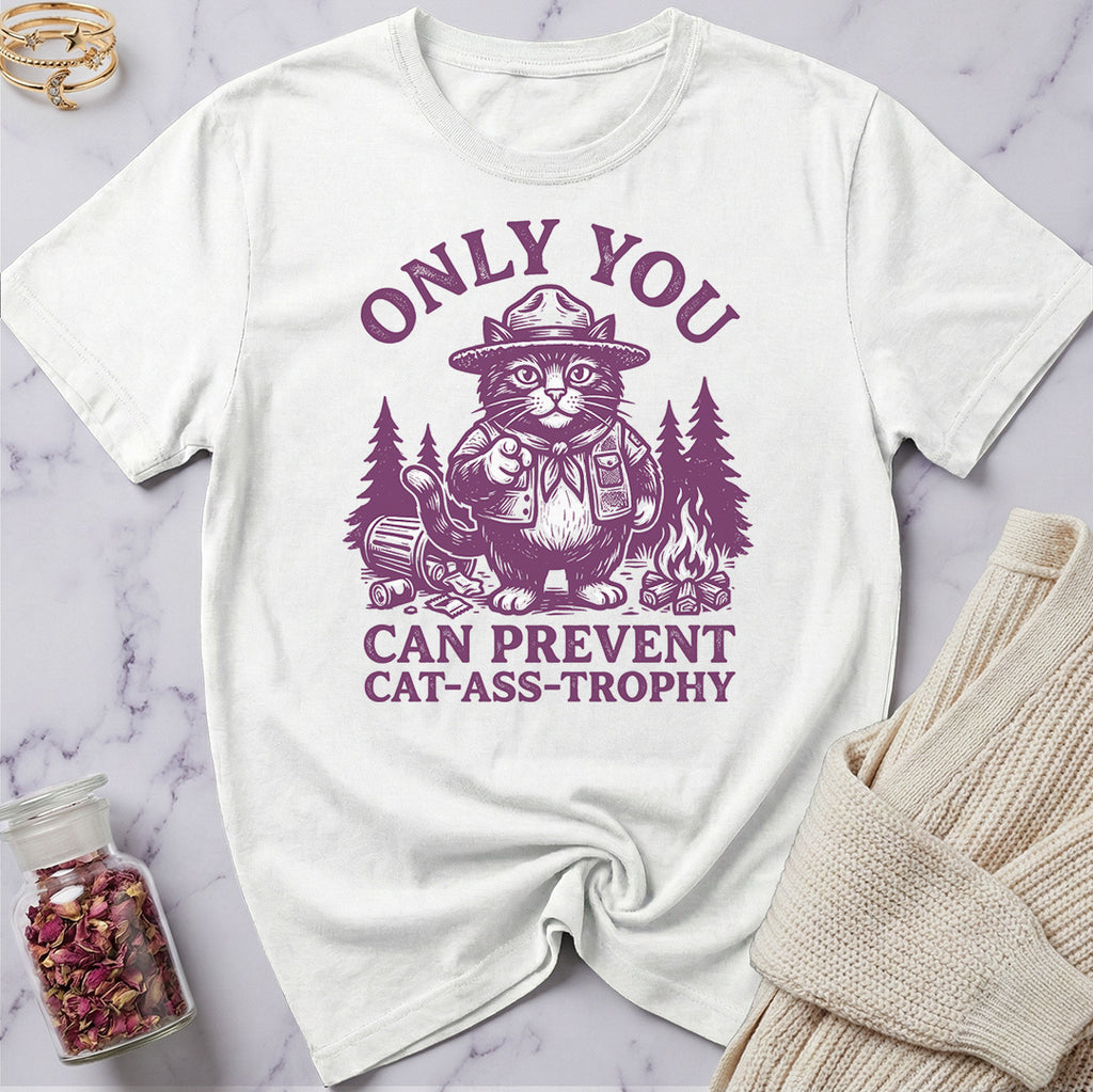 White t-shirt with purple graphic and text on a marble surface
