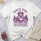 White t-shirt with purple graphic and text on a marble surface