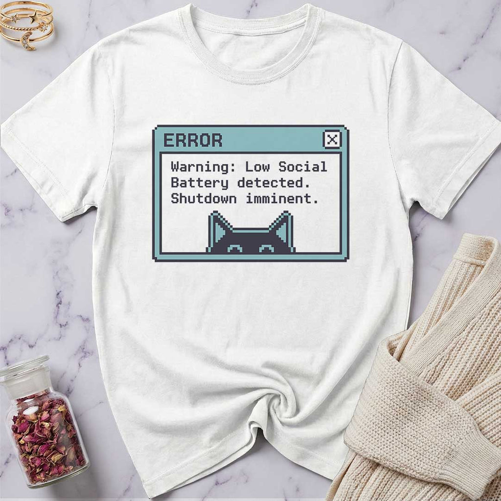 White t-shirt with a graphic design on a marble surface