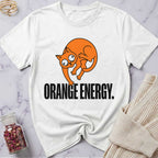 White t-shirt with orange cat graphic and 'Orange Energy' text on a marble surface.