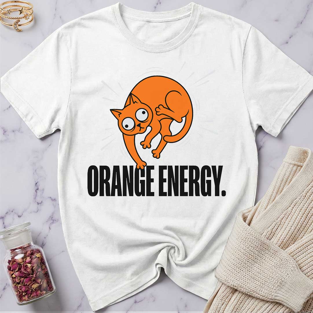White t-shirt with orange cat graphic and 'Orange Energy' text on a marble surface.