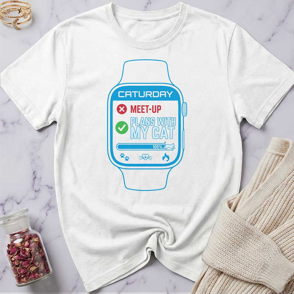 White t-shirt with a graphic of a digital watch on a marble surface